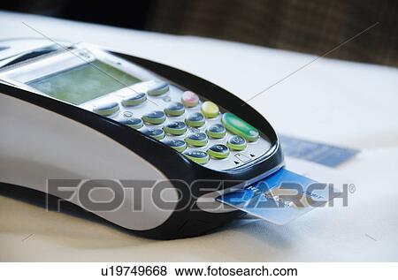 Stock Photo - Close up of credit cards reader. Fotosearch