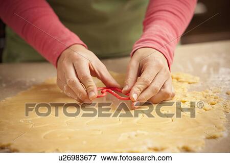 Close-up of girl (6-7) making cookies View Large Photo Image Stock Photo - Close-up of girl (6-7) making cookies. Fotosearch