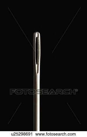 Stock Image - Close up of needle on black background. Fotosearch