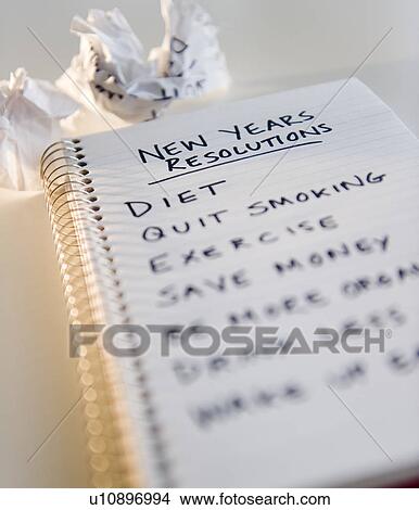 Picture - Close up of notebook with list of resolutions for new year. Fotosearch