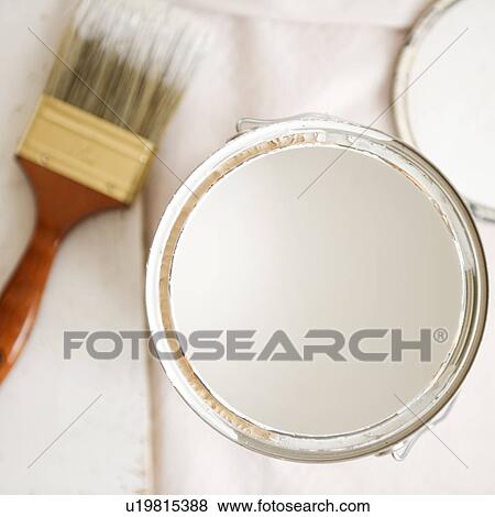 Stock Photo - Close up of paint can and paint brush. Fotosearch
