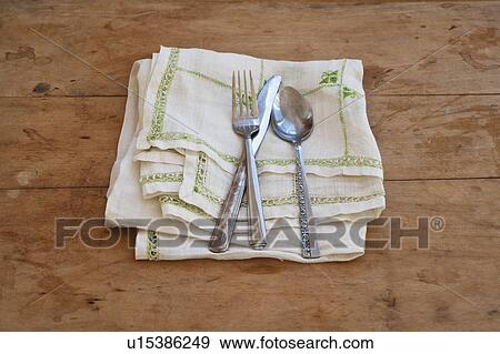 Close up of silverware on dish towel View Large Photo Image Stock Photo - Close up of silverware on dish towel. Fotosearch