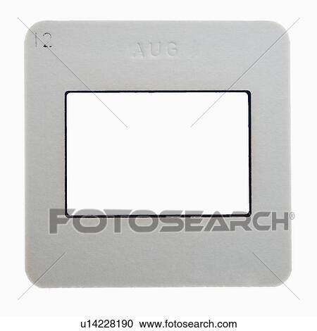 Stock Image - Close up of slide frame on light box. Fotosearch