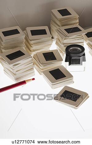 Picture - Close up of slides and on light box. Fotosearch