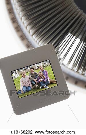 Stock Image - Close up of slides and on round slide tray. Fotosearch