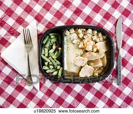 Close up of TV dinner on checked table cloth View Large Photo Image Stock Photography - Close up of TV dinner on checked table cloth. Fotosearch