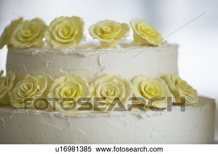 Close-up on wedding cake decorated with flowers View Large Photo Image Stock Photography - Close-up on wedding cake decorated with flowers. Fotosearch