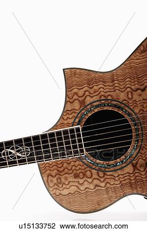 Stock Image - Close-up view of acoustic guitar. Fotosearch