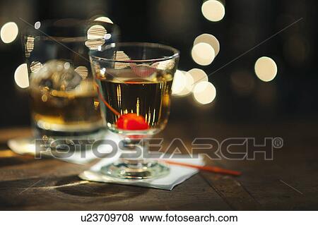 Stock Photo - Close-up view of alcoholic drinks on bar counter. Fotosearch