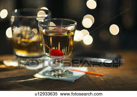 Close-up view of alcoholic drinks on bar counter View Large Photo Image Stock Photography - Close-up view of alcoholic drinks on bar counter. Fotosearch