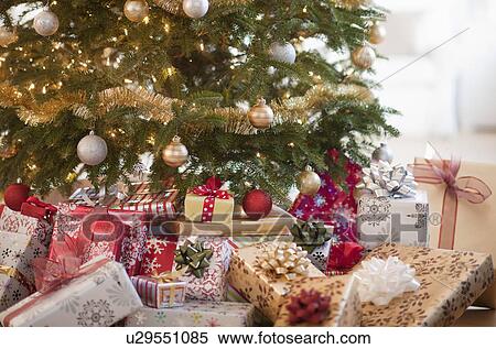 Colorful gifts under christmas tree View Large Photo Image Stock Photography - Colorful gifts under christmas tree. Fotosearch