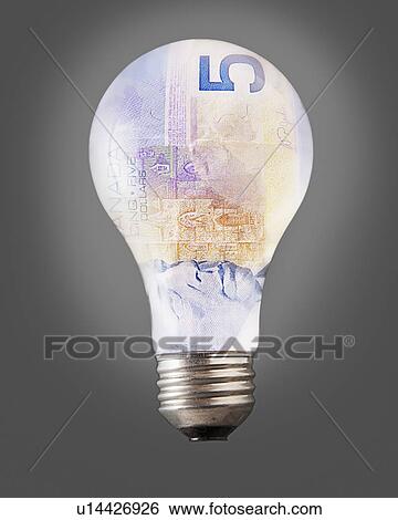 Stock Photograph - Composition of bulb and five canadian dollar banknote. Fotosearch