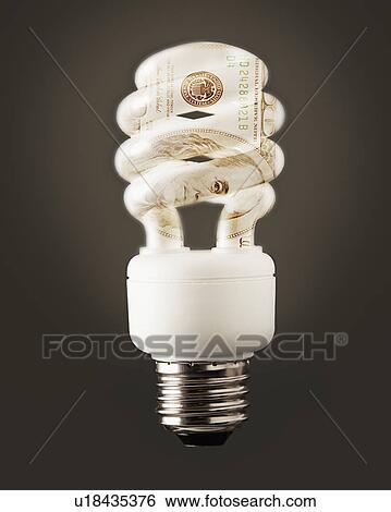 Stock Photograph - Composition of energy efficient bulb and one hundred dollar note. Fotosearch