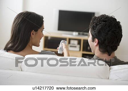 Couple watching tv View Large Photo Image Stock Image - Couple watching tv. Fotosearch