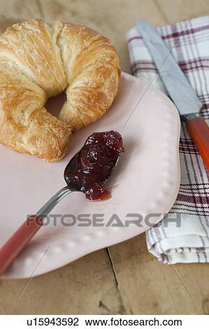 Croissant with jam on plate View Large Photo Image Stock Image - Croissant with jam on plate. Fotosearch