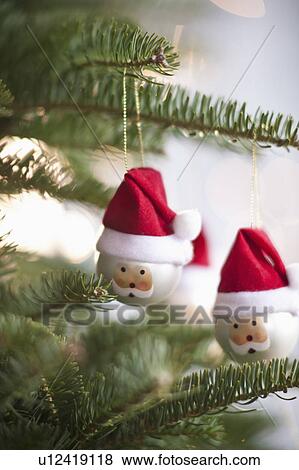 Father Christmas baubles on tree View Large Photo Image Stock Photo - Father Christmas baubles on tree. Fotosearch