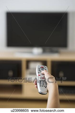 Female hand holding remote control View Large Photo Image Stock Photography - Female hand holding remote control. Fotosearch