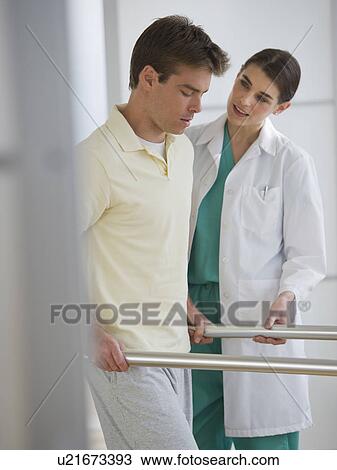 Female physiotherapist assisting patient with recovery exercise View Large Photo Image Stock Image - Female physiotherapist assisting patient with recovery exercise. Fotosearch
