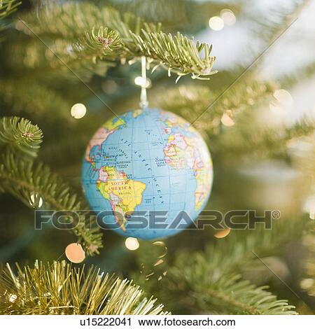 Globe bauble on Christmas tree View Large Photo Image Stock Image - Globe bauble on Christmas tree. Fotosearch