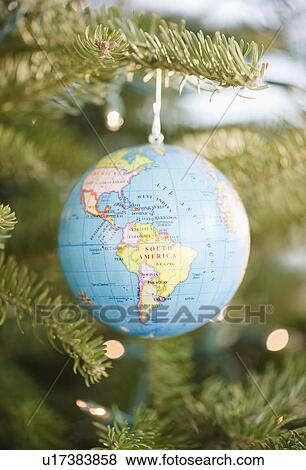 Globe bauble on Christmas tree View Large Photo Image Stock Photo - Globe bauble on Christmas tree. Fotosearch