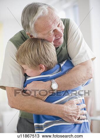 Grandfather hugging grandson (8-9) View Large Photo Image Stock Image - Grandfather hugging grandson (8-9) . Fotosearch
