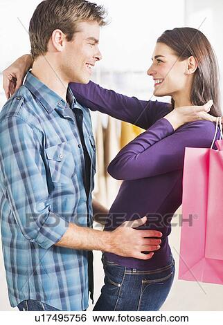 Happy couple shopping View Large Photo Image Stock Photograph - Happy couple shopping. Fotosearch