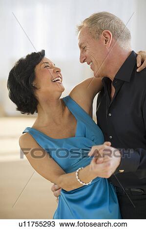 Happy mature couple dancing View Large Photo Image Stock Image - Happy mature couple dancing. Fotosearch