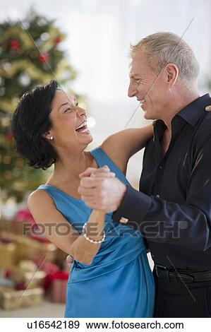 Happy mature couple dancing View Large Photo Image Stock Photo - Happy mature couple dancing. Fotosearch