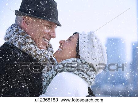 Happy mature couple in winter scenery View Large Photo Image Stock Image - Happy mature couple in winter scenery. Fotosearch