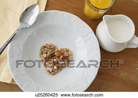 Stock Photography - Heart shaped breakfast cereal in bowl. Fotosearch