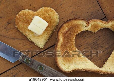 Heart shaped toast on table View Large Photo Image Stock Image - Heart shaped toast on table. Fotosearch