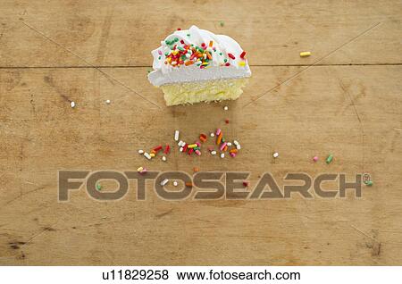 Homemade cupcake with missing bite View Large Photo Image Stock Photo - Homemade cupcake with missing bite. Fotosearch