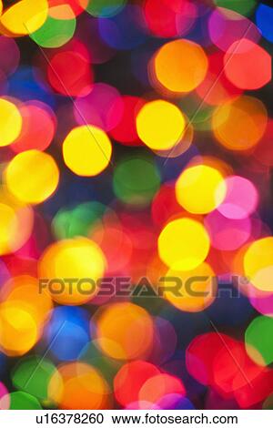 Stock Image - Illuminated Christmas tree lights. Fotosearch