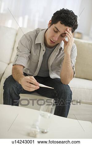 Man taking painkillers View Large Photo Image Stock Image - Man taking painkillers. Fotosearch