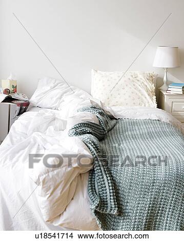 Messy bed in bedroom View Large Photo Image Picture - Messy bed in bedroom. Fotosearch