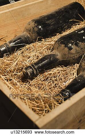 Old wine bottles in wooden box View Large Photo Image Stock Image - Old wine bottles in wooden box. Fotosearch