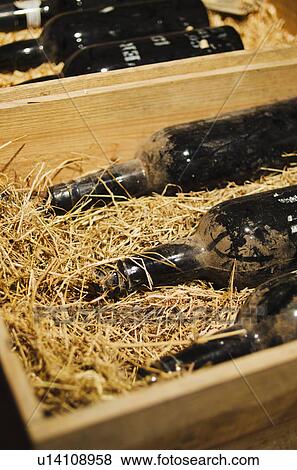 Old wine bottles in wooden box View Large Photo Image Stock Photo - Old wine bottles in wooden box. Fotosearch