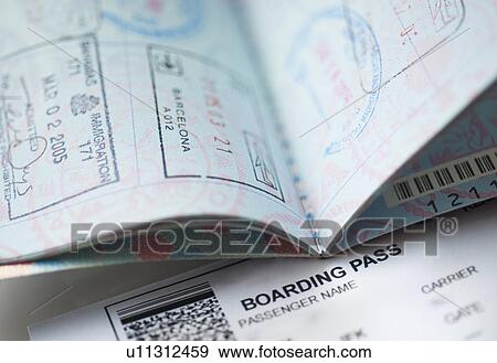 Passport with boarding pass inside View Large Photo Image Stock Photo - Passport with boarding pass inside. Fotosearch