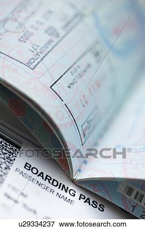 Passport with boarding pass inside View Large Photo Image Stock Photo - Passport with boarding pass inside. Fotosearch