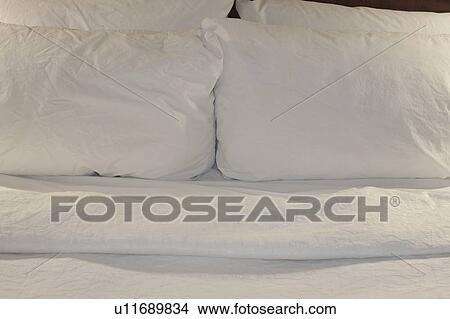 Picture - Pillows on double bed. Fotosearch