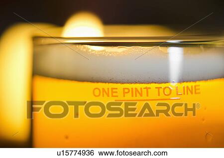 Stock Photograph - Pint of beer, close-up. Fotosearch