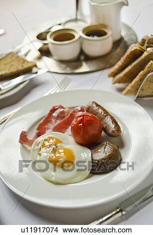Picture - Plate with English breakfast on table. Fotosearch