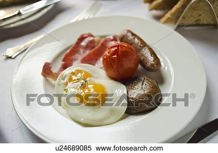 Stock Photography - Plate with English breakfast on table. Fotosearch