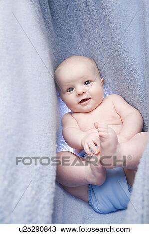 Portrait of baby boy (6-11 months) in bedclothes View Large Photo Image Stock Image - Portrait of baby boy (6-11 months) in bedclothes. Fotosearch