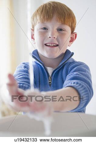 Portrait of boy (8-9) washing hands View Large Photo Image Stock Image - Portrait of boy (8-9) washing hands. Fotosearch