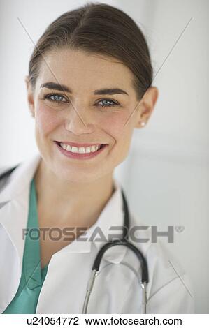 Portrait of cheerful female doctor View Large Photo Image Stock Image - Portrait of cheerful female doctor. Fotosearch