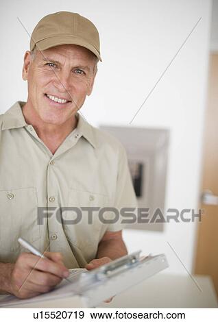 Stock Photo - Portrait of mature technician. Fotosearch