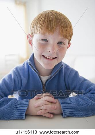 Stock Image - Portrait of smiling boy (8-9) . Fotosearch