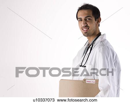 Stock Image - Portrait of young doctor. Fotosearch