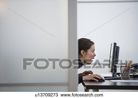 Portrait of young woman in office View Large Photo Image Stock Image - Portrait of young woman in office. Fotosearch